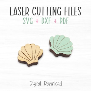 May include: Two laser cut wooden seashells, one is light brown and the other is light green. The text "LASER CUTTING FILES SVG + DXF + PDF" is above the shells. The text "Digital Download" is below the shells.