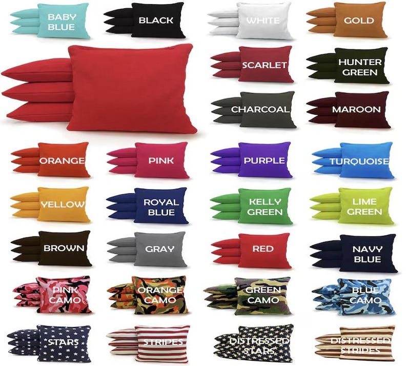 May include: A set of 24 bean bags in various colors and patterns. The bean bags are arranged in rows of four, with each row featuring a different theme. The themes include solid colors, camouflage patterns, and patriotic designs. The bean bags are ideal for playing cornhole or other bean bag games.