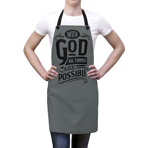 May include: A gray apron with black text that reads "With God All Things Are Possible".