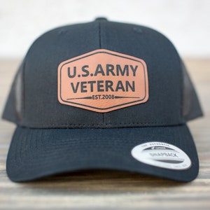May include: Black trucker hat with a brown leather patch that reads "U.S. ARMY VETERAN EST. 2008".