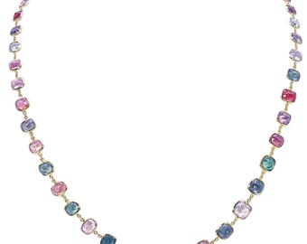 May include: A gold chain necklace with a row of colorful square-shaped gemstones. The gemstones are in shades of pink, purple, blue, and green.