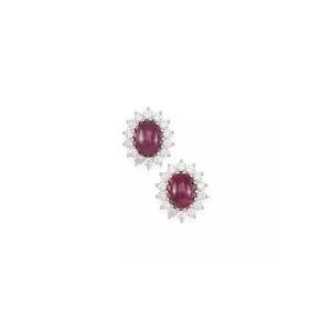 May include: A pair of ruby and diamond earrings. Each earring features a cabochon ruby surrounded by a halo of round brilliant diamonds.