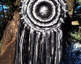 Black and grey weaver