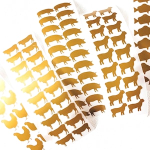 May include: Gold foil stickers featuring farm animals and fish. The stickers include images of chickens, pigs, sheep, cows, and fish. The stickers are arranged in rows on white backing.