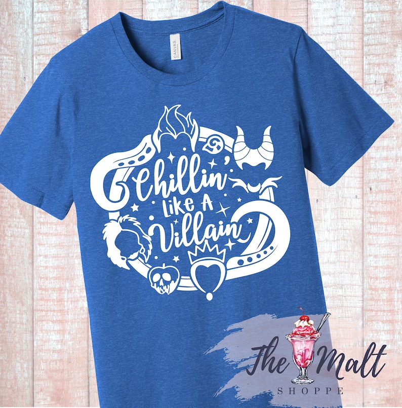 May include: A royal blue t-shirt with a white graphic design featuring a circle of Disney villain icons and the text "Chillin' Like A Villain".