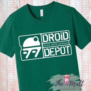 May include: A green t-shirt with a white graphic of a droid and the text "Droid Depot".