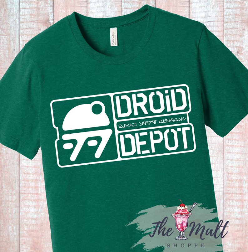 May include: A green t-shirt with a white graphic of a droid and the text "Droid Depot".