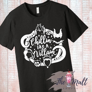 May include: Black t-shirt with a white design featuring Disney villains. The design includes the text "Chillin' Like A Villain" and images of Maleficent, Ursula, the Evil Queen, and Cruella de Vil.