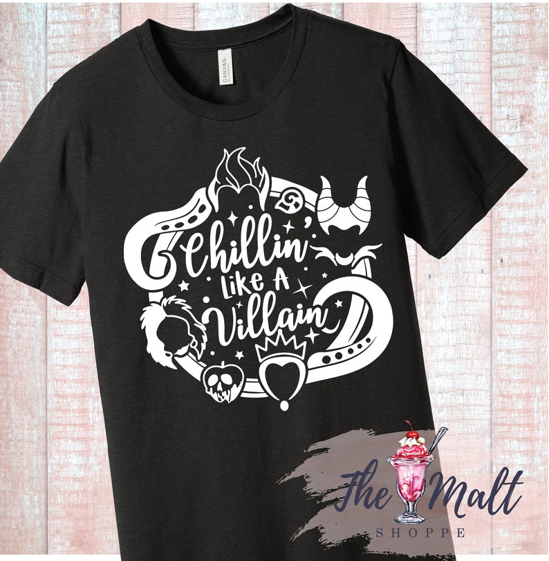 May include: Black t-shirt with a white design featuring Disney villains. The design includes the text "Chillin' Like A Villain" and images of Maleficent, Ursula, the Evil Queen, and Cruella de Vil.
