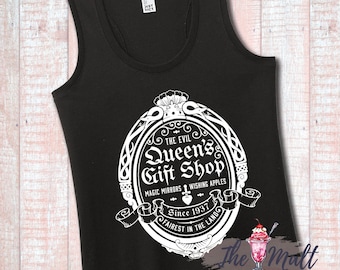 May include: Black tank top with a white graphic of a vintage-style logo for "The Evil Queen's Gift Shop". The logo features a crown, a mirror, and the text "Magic Mirrors Wishing Apples Since 1937 Fairest in the Land".