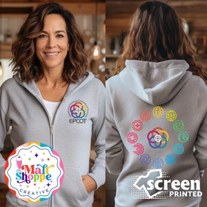 May include: Gray hooded sweatshirt with a colorful logo on the front that says "EPCOT" and a circle of colorful logos on the back. The back of the sweatshirt also has the text "screen printed".
