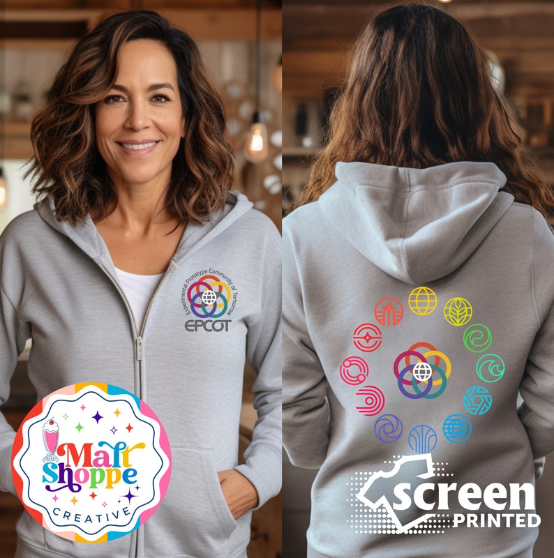 May include: Gray hooded sweatshirt with a colorful logo on the front that says "EPCOT" and a circle of colorful logos on the back. The back of the sweatshirt also has the text "screen printed".