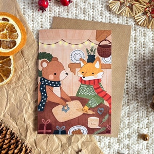Carte de vœux de Noël A6 avec enveloppe - Renard et ours préparant des biscuits