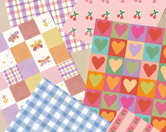 May include: A collection of patterned papers featuring various designs. Includes a pink cherry print, a colorful heart grid, a blue gingham, a patchwork with butterflies, a pink floral stripe, and a purple plaid pattern.