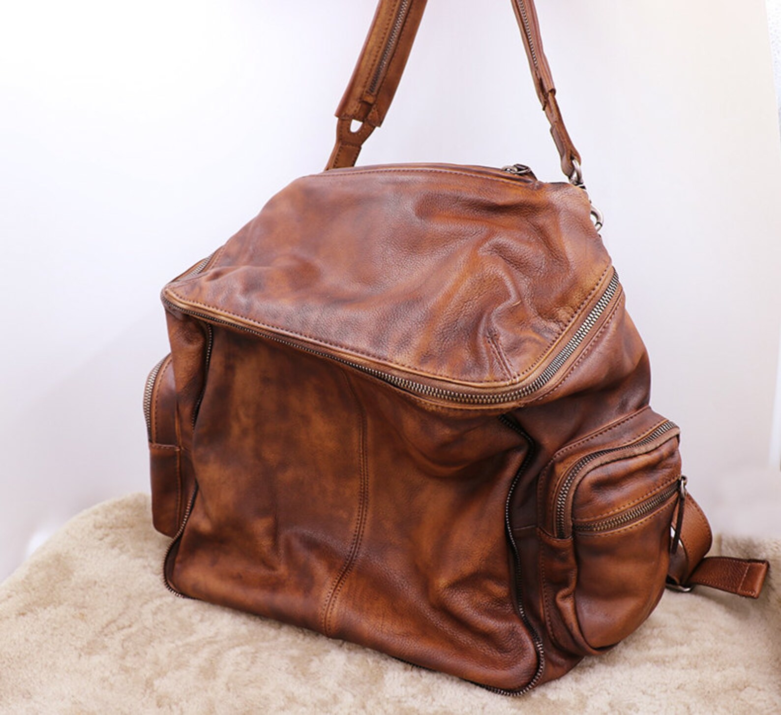 brown shoulder travel bag