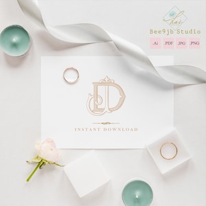 May include: A white card with a gold monogram and the words "INSTANT DOWNLOAD". Two gold rings, a white ribbon, two teal candles, a small white rose, and a small white square are arranged around the card.