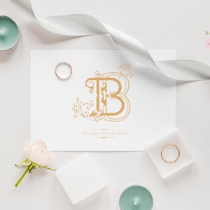 Op de afbeelding: Een gouden trouwmonogram met de letter "B" omringd door sierlijke bloemmotieven. Het monogram is op een witte kaart met de tekst "Direct downloaden".
