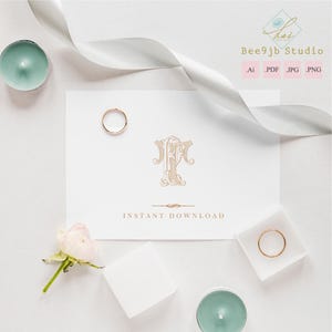 May include: A flat lay featuring a white card with gold monogram initials and the words "INSTANT DOWNLOAD". Two gold rings, a white ribbon, a small pink rose, two teal candles, and a white square are arranged around the card. The image is from Bee9jb Studio.