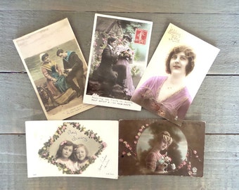 Set of 5 Vintage Romantic postcards.  2 Romantic couples. 2 Romantic women. 1 Children postcard.
