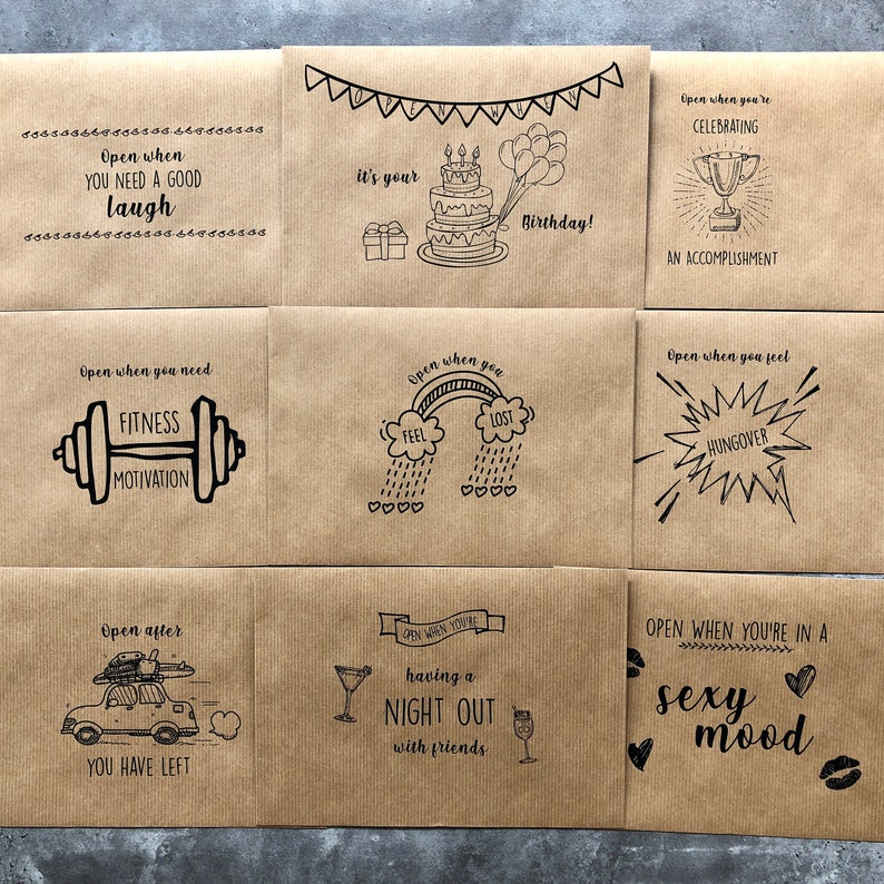 May include: Nine brown paper envelopes with black ink drawings and text. Each envelope has a different occasion or feeling written on it, such as "Open when you need a good laugh", "Open when you need fitness motivation", "Open when you feel lost", "Open when you're celebrating an accomplishment", "Open when you feel hungover", "Open after you have left", "Open when you're having a night out with friends", and "Open when you're in a sexy mood".