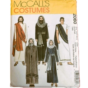May include: A McCall's Costumes sewing pattern envelope, number 2060, size Ex-Small. The front displays illustrations of five figures wearing various historical-style robes, tunics, and head coverings in shades of white, brown, black, and blue.