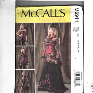 May include: McCall's Costumes pattern M6911 features a woman in a red and black costume. The pattern includes a long black skirt with red accents and a red bodice. The pattern size is A5, fitting sizes 6-8-10-12-14.