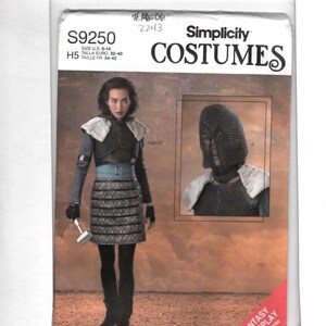 May include: Simplicity Costumes pattern S9250 for fantasy cosplay. The package features a woman in a medieval-style outfit with a skirt, armor, and a helmet. Includes size information: U.S. 6-14.