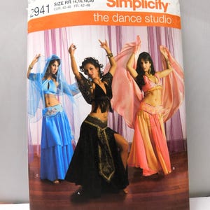 May include: Simplicity dance studio pattern featuring three dancers in colorful belly dance costumes. The pattern number is 2941, with sizes RR 14, 16, 18, and 20. The image includes the text "Simplicity the dance studio."