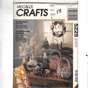 May include: McCall's Crafts pattern cover featuring Easter-themed crafts. The image showcases handmade wreaths, baskets, and bunny decorations. Text includes "Springtime in the '90's" and "MartiMichell."