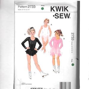 May include: Kwik-Sew pattern 2733 for ice skating dresses, sizes 8-10-12-14. The illustration shows three different dresses: a white dress, a pink dress, and a black dress with a jeweled bodice. The pattern includes the Kwik-Sew logo.