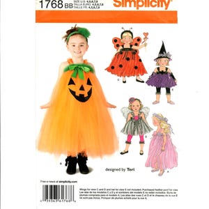 May include: Simplicity pattern 1768 featuring children's Halloween costume designs. The orange and black pumpkin costume is shown, along with a ladybug, witch, fairy, and princess. The pattern includes sizes 4, 5, 6, 7, and 8.