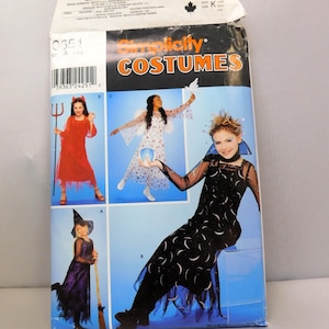 May include: A Simplicity Costumes pattern envelope featuring images of Halloween costumes. The envelope displays a devil, fairy, and witch costume. The text "Simplicity COSTUMES" is printed in orange and white.