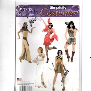 May include: A Simplicity Costumes sewing pattern envelope S0793 featuring illustrations of five different costume designs including an Egyptian gown, a red flapper dress, a leopard print cave-person outfit, a white toga, and a fringed tunic with a bow.