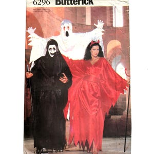 May include: A vintage sewing pattern for Halloween costumes. The pattern is for a ghost, a devil, and a grim reaper. The pattern number is 6296 and the brand is Butterick.