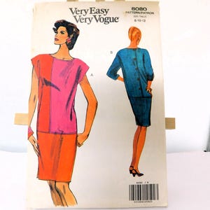 May include: Vintage sewing pattern for a dress with a pink and orange color scheme. The pattern is for sizes 8-10-12 and is labeled "Very Easy Very Vogue" and "8080".