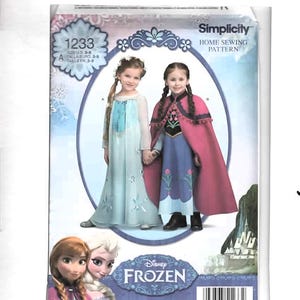 May include: Simplicity home sewing pattern 1233 for Disney Frozen costumes. The package features two children wearing floor-length dresses, one in light blue with sheer sleeves and one in blue with a pink cape. Includes a barcode and text.