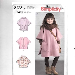 May include: Simplicity sewing pattern 8428 A, featuring a pink cape with pockets and a hood. The pattern includes sizes S-L. The image also shows a girl wearing a pink cape. The text "easy-to-sew" is visible.