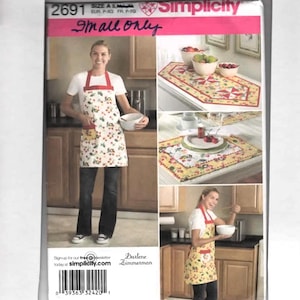 May include: Simplicity pattern 2691, featuring a woman wearing a cherry-print apron with a red neck strap. The pattern includes images of kitchen textiles. The text "Small only" is visible.