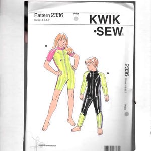 May include: A Kwik Sew pattern 2336 featuring illustrations of children's swimwear. The pattern includes sizes 4-5-6-7. One design is yellow with pink sleeves, and the other is black with yellow accents. The Kwik Sew logo is visible.