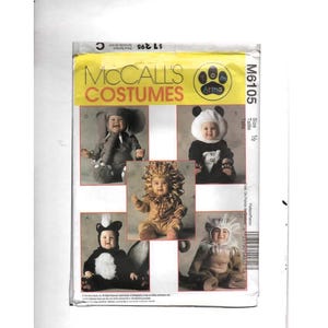 May include: A McCall's Costumes sewing pattern, M6105, featuring baby costumes. The pattern includes designs for an elephant, panda, lion, and skunk. The pattern is size 1/2.