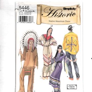 May include: Simplicity 5446 sewing pattern envelope for a Native American dress and clothing set. The cover features illustrations of four outfits labeled A, B, C, and D, including a fringed tunic with a headdress, a long dress, and a yellow jacket.
