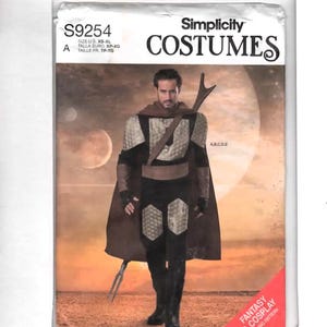 May include: Simplicity Costumes sewing pattern S9254. The pattern features a fantasy and cosplay design. The image shows a person wearing the costume. The pattern includes sizes XS-XL. The cover has the text "Fantasy & Cosplay Sewing Pattern".