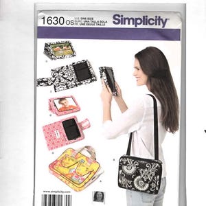 May include: Simplicity sewing pattern 1630 for tablet cases and bags. The pattern includes instructions for various styles, including a black and white damask print case, a pink geometric print case, and a yellow floral print bag with handles.