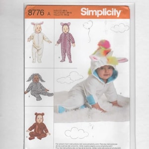 May include: Simplicity sewing pattern 8776 for infant costumes in sizes XS-L. The package features illustrations of various hooded jumpsuits including a white unicorn with a rainbow mane, a brown bear, a spotted animal, and a white bunny with long ears.