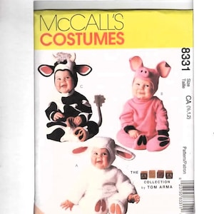 May include: McCall's Costumes pattern 8331 for infant animal costumes. The envelope features illustrations of three babies wearing a black and white cow costume, a pink pig costume, and a white lamb costume, with The Arma Collection by Tom Arma text.