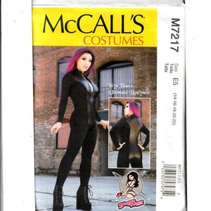 May include: A sewing pattern for a black bodysuit with a zipper down the front. The pattern is for sizes 14-16-18-20-22. The pattern is from McCall's Costumes and is called "Yaya Han's Ultimate Bodysuit".