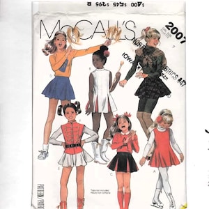 May include: McCall's sewing pattern featuring illustrations of girls in various outfits. The pattern includes designs for skirts, tops, and dresses. The image includes the text "GIRL SIZE FILLETTE 2007".