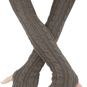 May include: A pair of brown knitted arm warmers with a cable knit pattern. The arm warmers are fingerless and extend to the elbow.