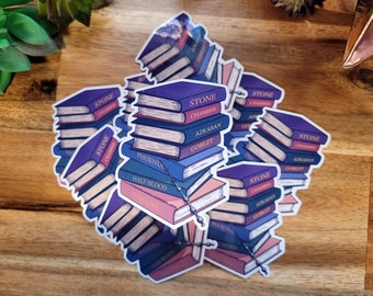 Libros de Potter apilados con varita Pegatina