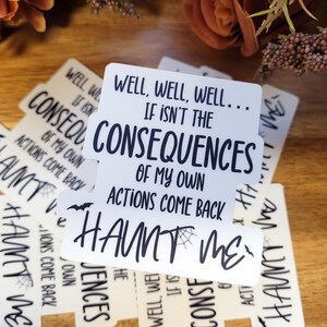 May include: A set of white stickers with black text and a spider web design. The text reads "Well, well, well... If isn't the consequences of my own actions come back to haunt me."